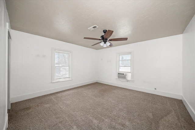 unfurnished room featuring ceiling fan, carpet flooring, and a textured ceiling