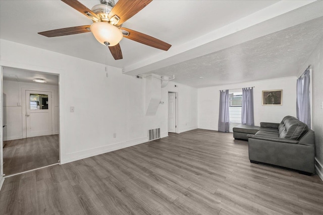 unfurnished living room with hardwood / wood-style flooring, ceiling fan, and a textured ceiling