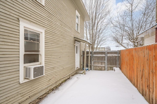 snow covered property featuring cooling unit