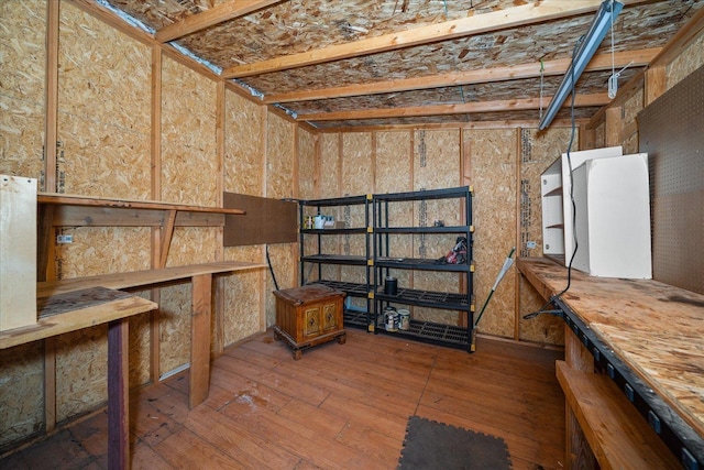 basement featuring hardwood / wood-style floors