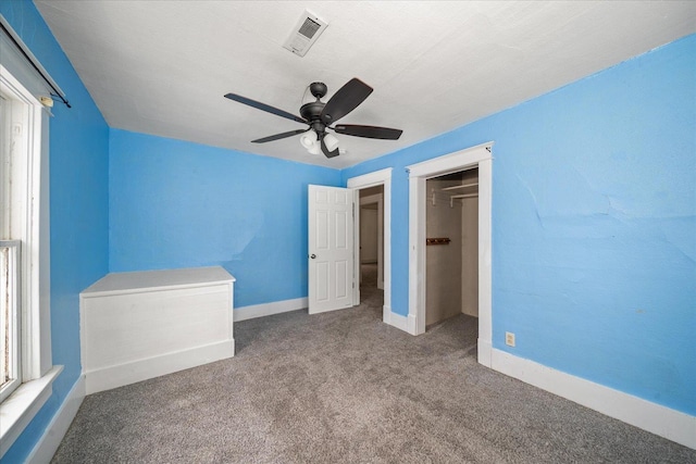 unfurnished bedroom with carpet floors, a closet, and ceiling fan