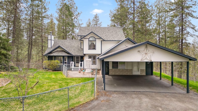 view of property with a carport and a front lawn