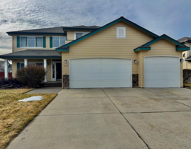 view of front of home with a garage and concrete driveway