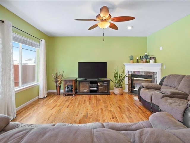 854 S Shelley Lake Ln, Spokane Valley, WA 99037 - living room with a ceiling fan, a fireplace, baseboards, and wood finished floors