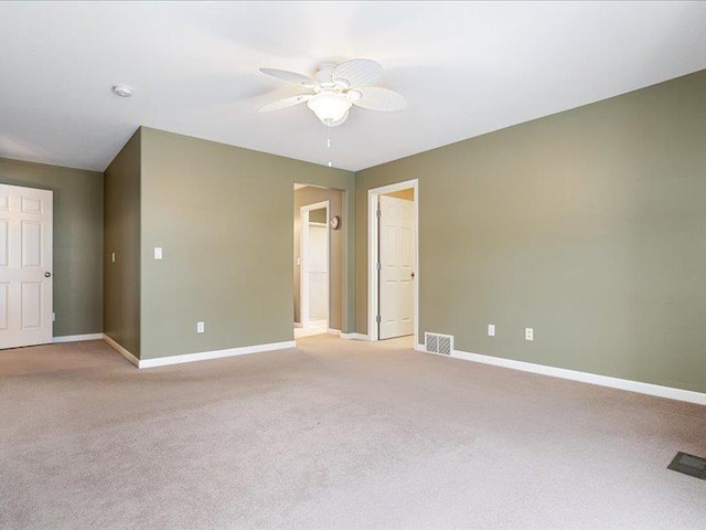 854 S Shelley Lake Ln, Spokane Valley, WA 99037 - spare room featuring visible vents, ceiling fan, light carpet, and baseboards