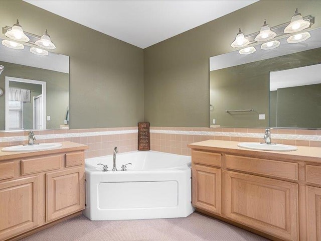 854 S Shelley Lake Ln, Spokane Valley, WA 99037 - full bathroom featuring two vanities, a garden tub, a sink, and tile walls