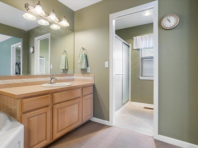 854 S Shelley Lake Ln, Spokane Valley, WA 99037 - full bath with a stall shower, visible vents, vanity, and baseboards