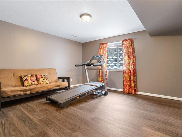 854 S Shelley Lake Ln, Spokane Valley, WA 99037 - workout area featuring visible vents, baseboards, and wood finished floors
