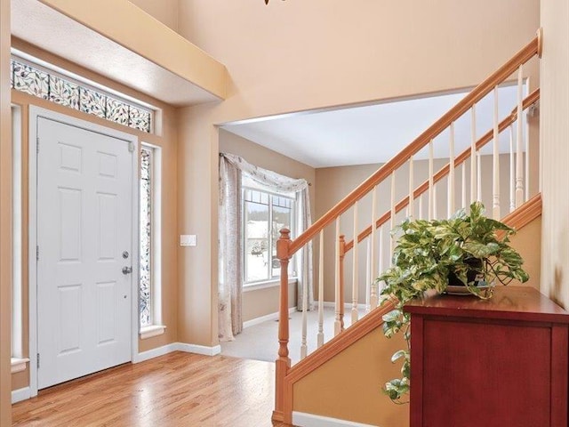 854 S Shelley Lake Ln, Spokane Valley, WA 99037 - foyer with baseboards, stairway, and wood finished floors