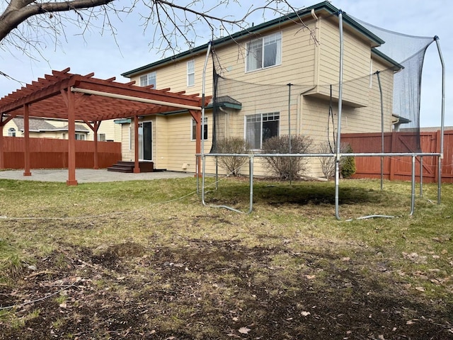 854 S Shelley Lake Ln, Spokane Valley, WA 99037 - back of property with a lawn, a trampoline, fence, a patio area, and a pergola