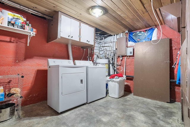 washroom with washer and clothes dryer, wooden ceiling, and cabinets