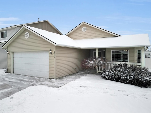 view of front of house with a garage and a porch