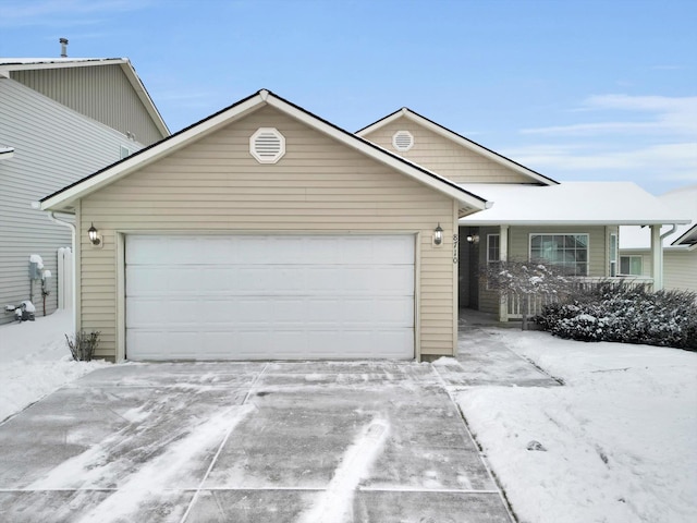 view of front of house with a garage and covered porch