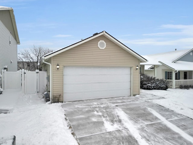 view of snow covered garage