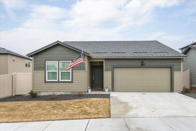 ranch-style home featuring a garage