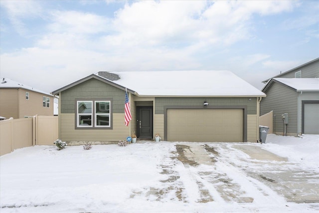 ranch-style house featuring a garage