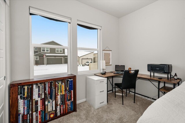 office featuring light carpet and baseboards