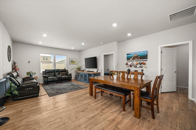 dining room with visible vents, wood finished floors, and recessed lighting