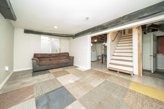 interior space featuring water heater and washer / dryer