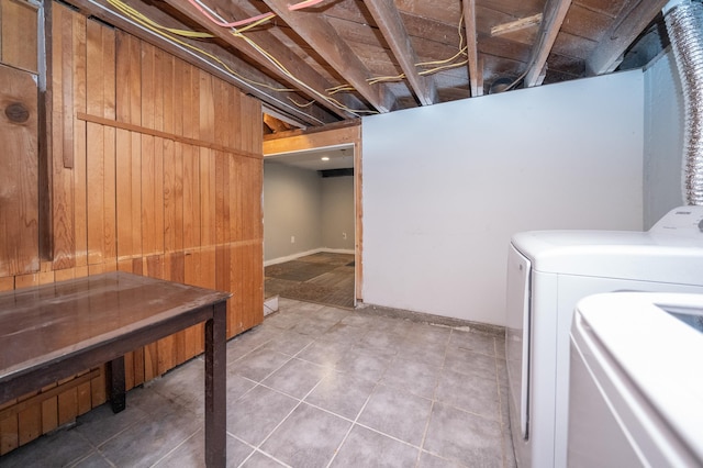 washroom with light tile patterned floors and washing machine and clothes dryer