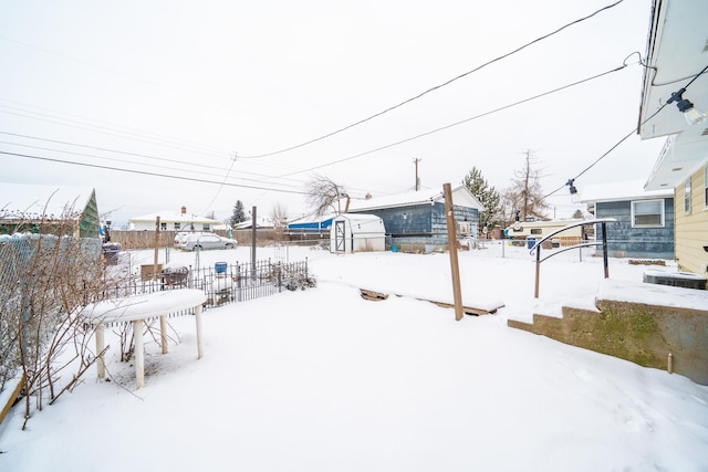 view of yard covered in snow