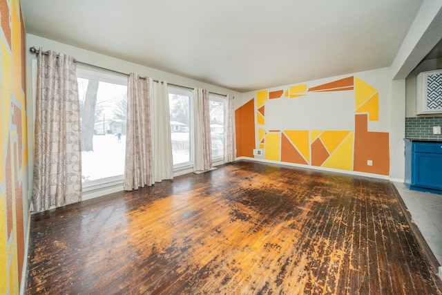 unfurnished living room featuring dark wood-type flooring