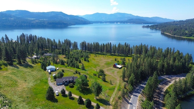 aerial view featuring a water and mountain view