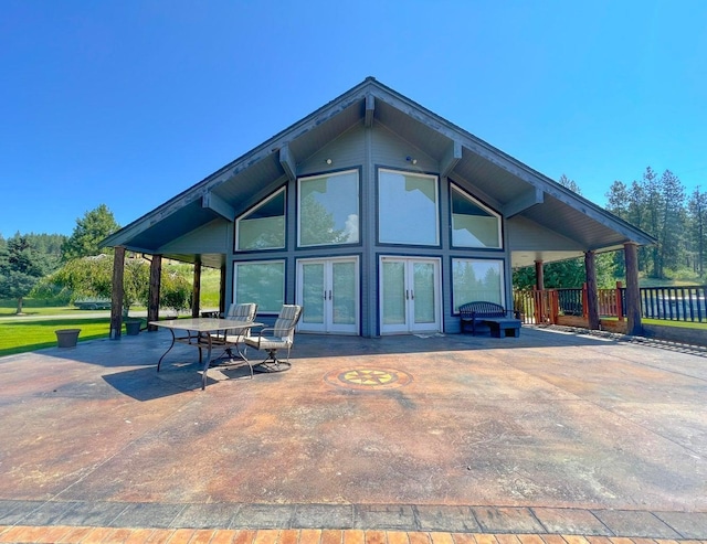 rear view of property featuring a patio and french doors