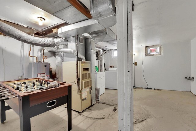 interior space with heating unit, washer / clothes dryer, and gas water heater