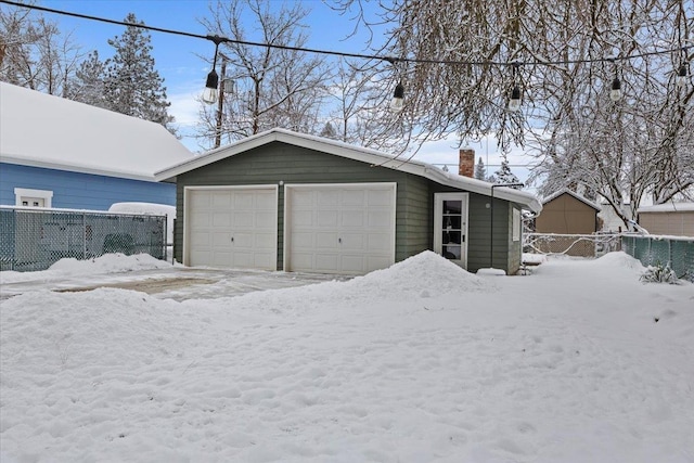 view of snow covered garage