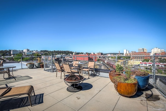 view of patio with a fire pit