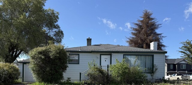 view of front facade with a chimney