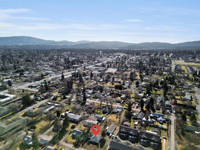 birds eye view of property with a mountain view