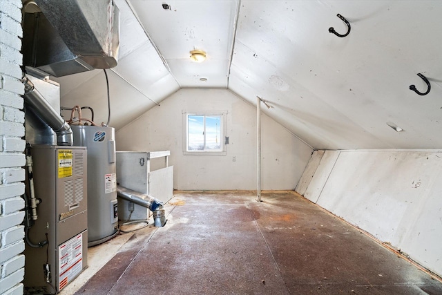 interior space featuring vaulted ceiling and water heater