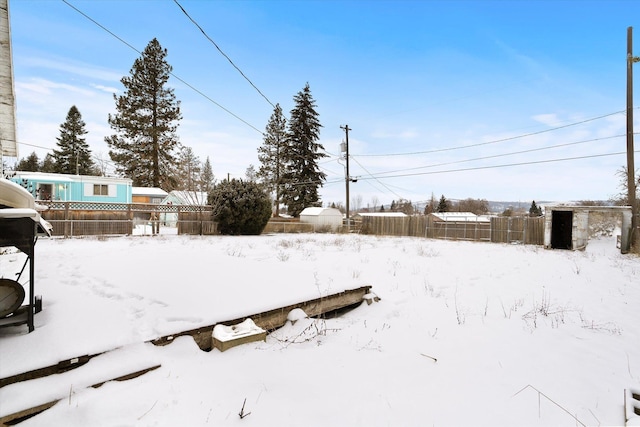 view of yard covered in snow