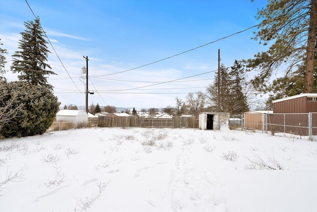 view of yard covered in snow