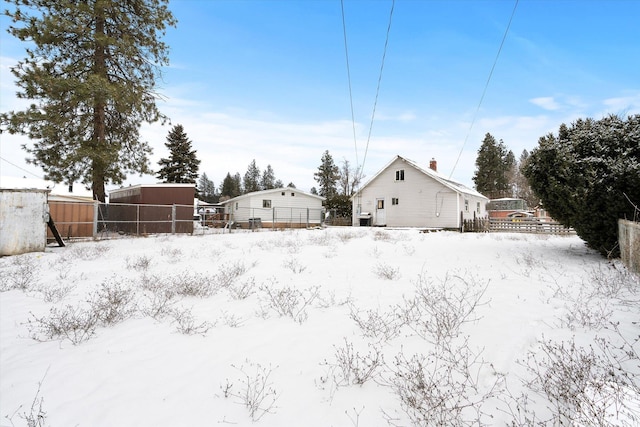 view of yard layered in snow