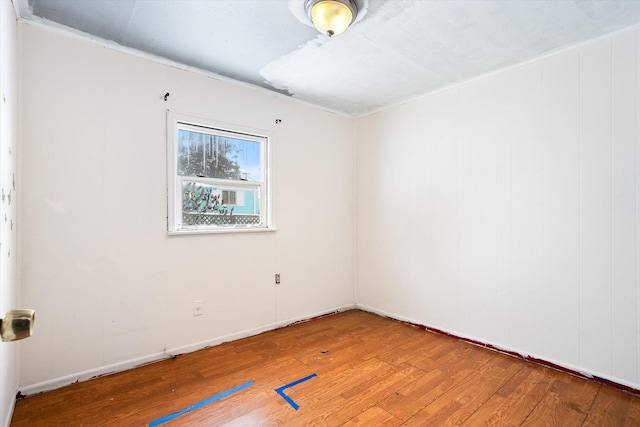 spare room featuring hardwood / wood-style floors