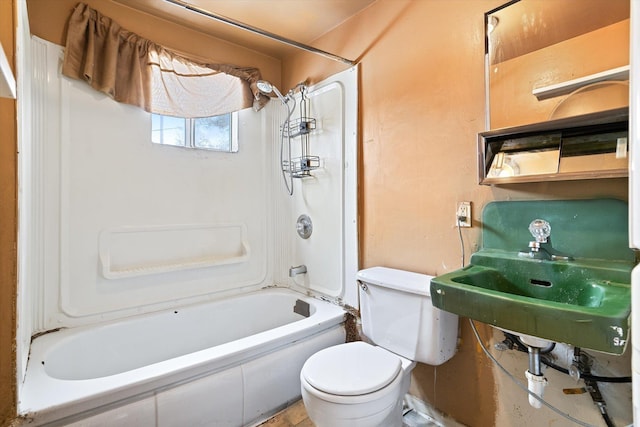 bathroom featuring toilet and sink