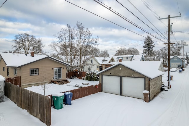 exterior space with an outbuilding and a garage