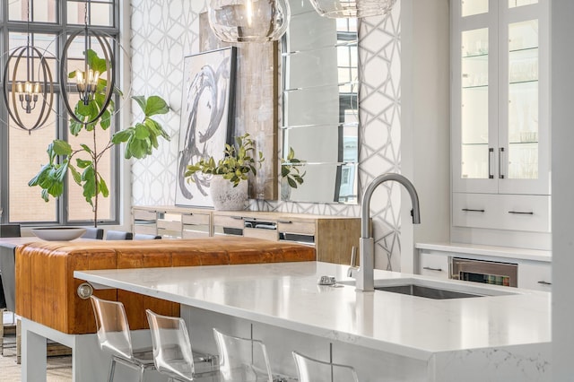 kitchen featuring sink and white cabinets