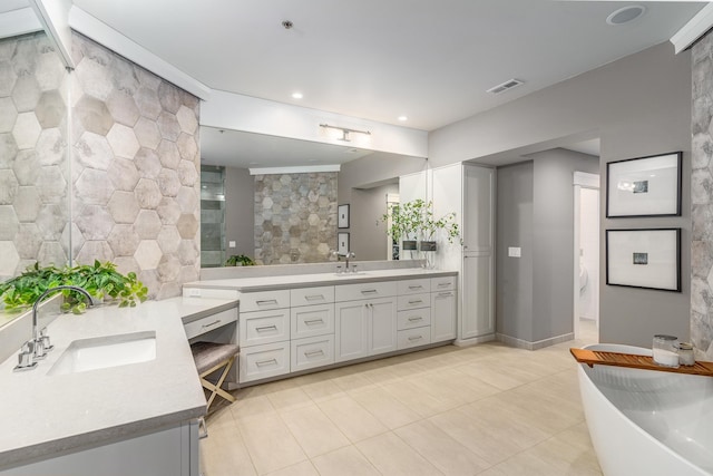 bathroom with vanity and tile patterned floors