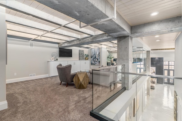 interior space featuring light colored carpet and wooden ceiling