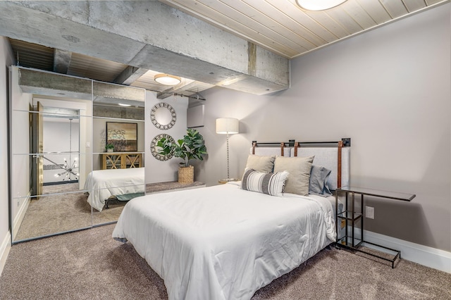 bedroom with carpet flooring and wood ceiling