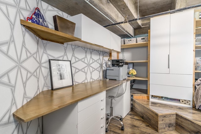 office featuring wood-type flooring and built in desk