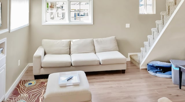 living room with light hardwood / wood-style flooring