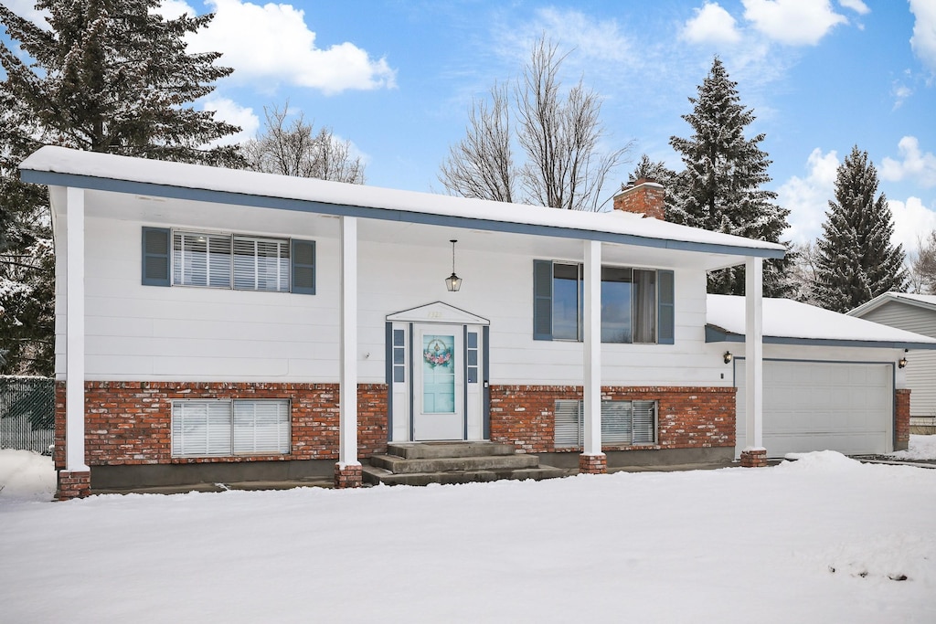 raised ranch featuring a garage