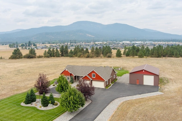 drone / aerial view with a mountain view and a rural view