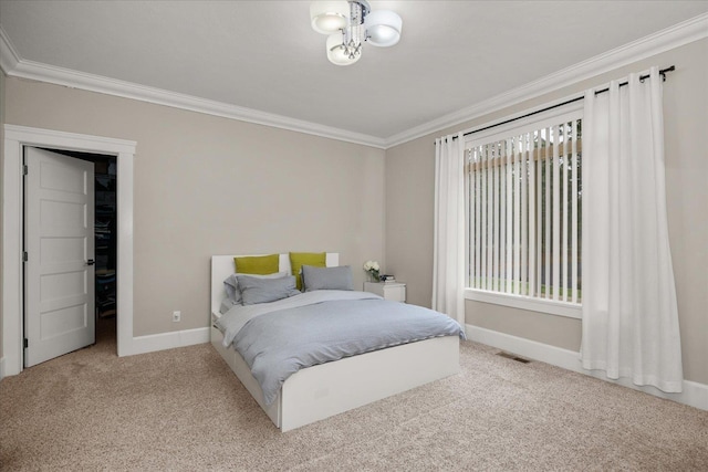 carpeted bedroom with crown molding