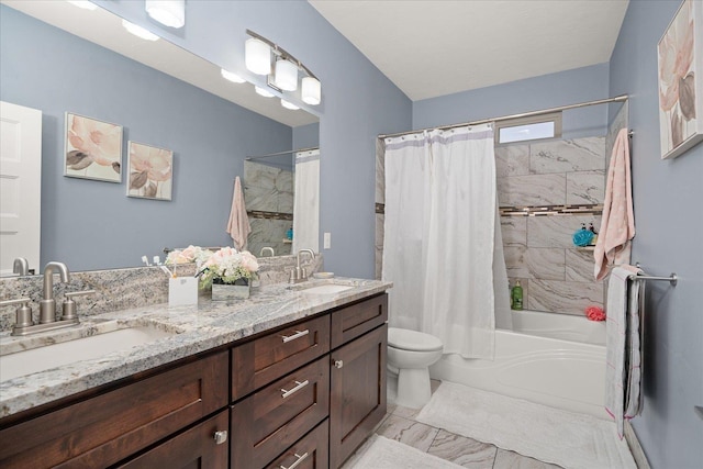 full bathroom with vanity, toilet, and shower / bath combo with shower curtain